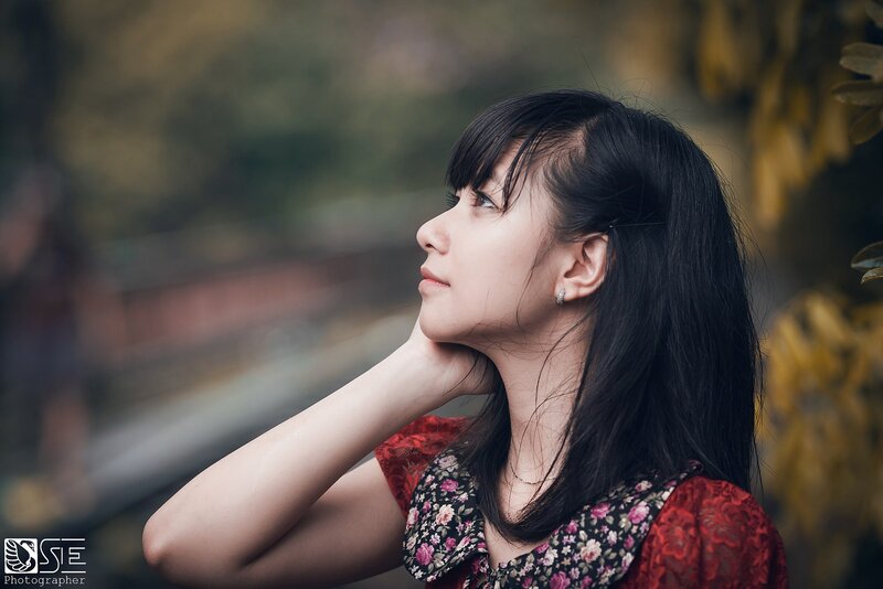 woman in floral dress looking up