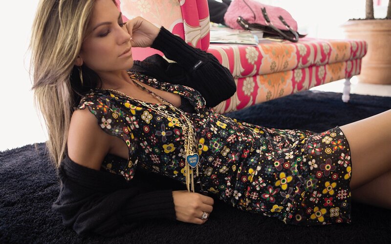 woman in floral dress lying down