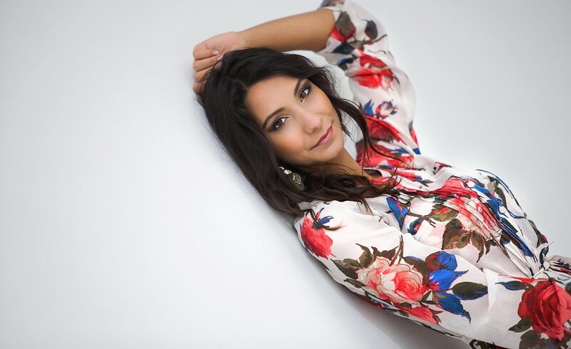 woman in floral dress lying down