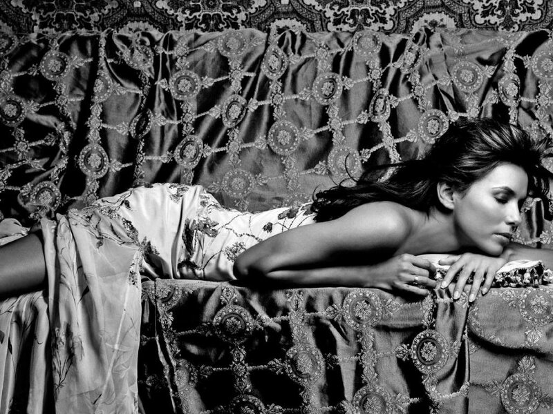 woman in floral dress lying on couch