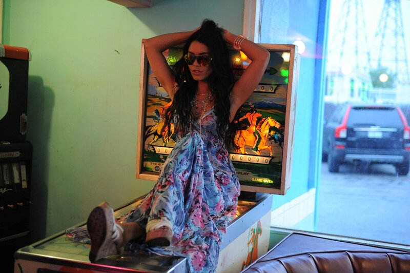 Woman in floral dress on arcade game