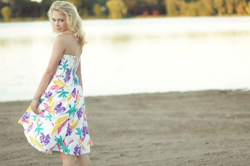 woman in floral dress on beach