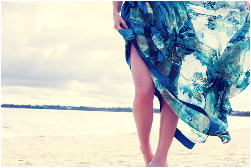 woman in floral dress on beach