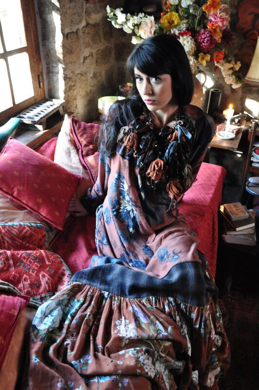 woman in floral dress on bed