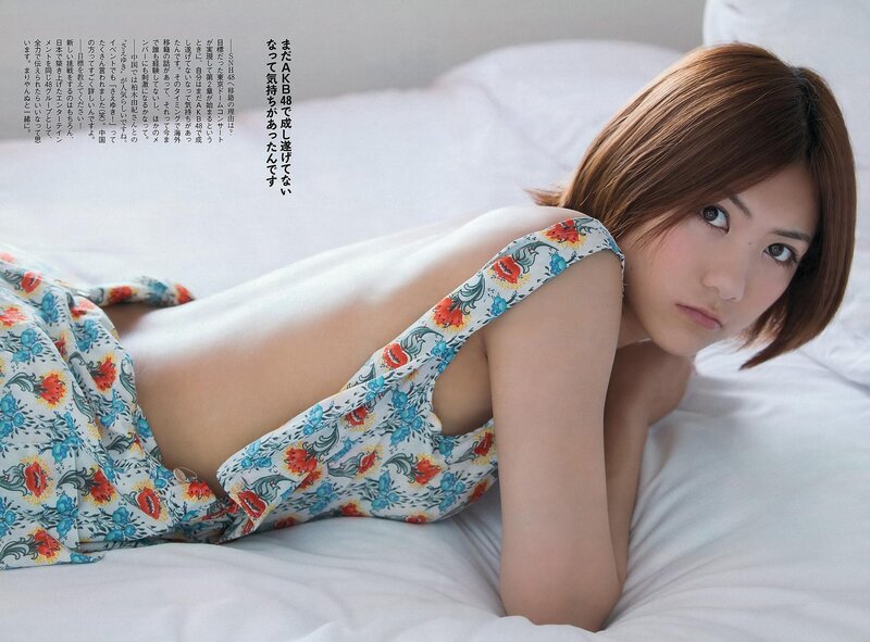 woman in floral dress on bed