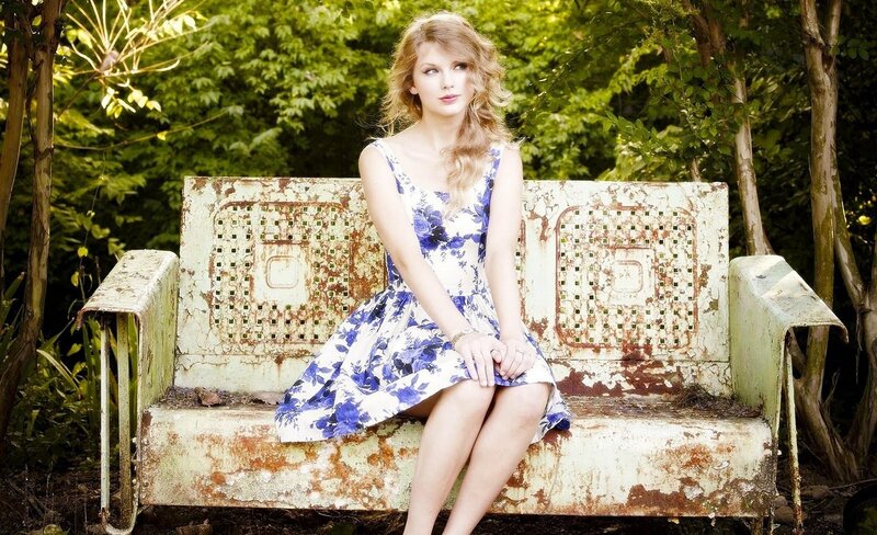 woman in floral dress on bench