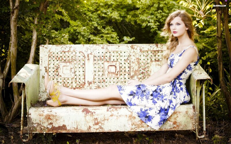 woman in floral dress on bench