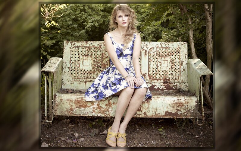 woman in floral dress on bench