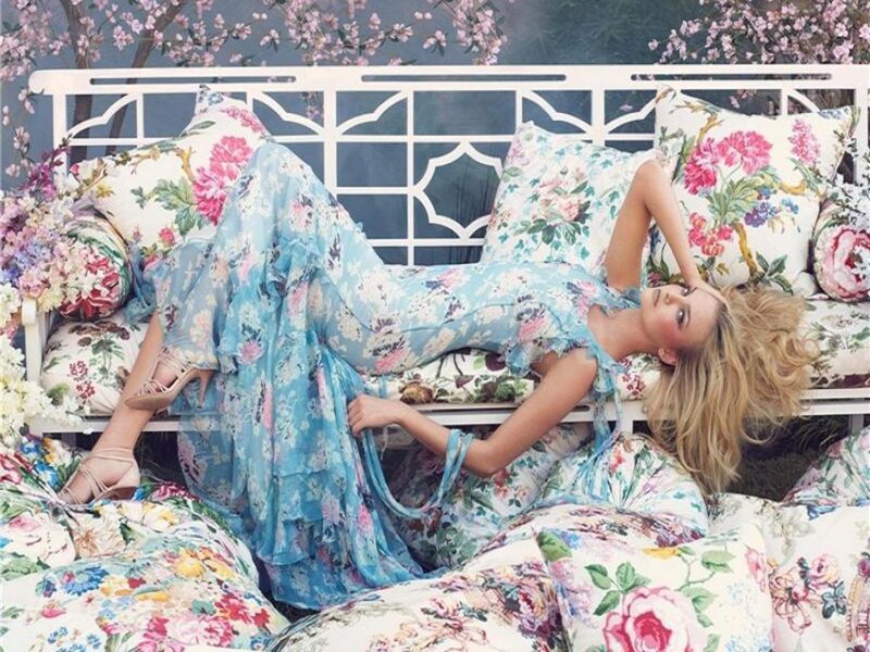 Woman in floral dress on bench