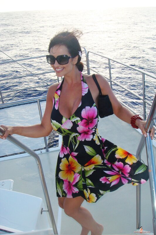 Woman in floral dress on boat