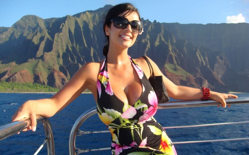 Woman in floral dress on boat