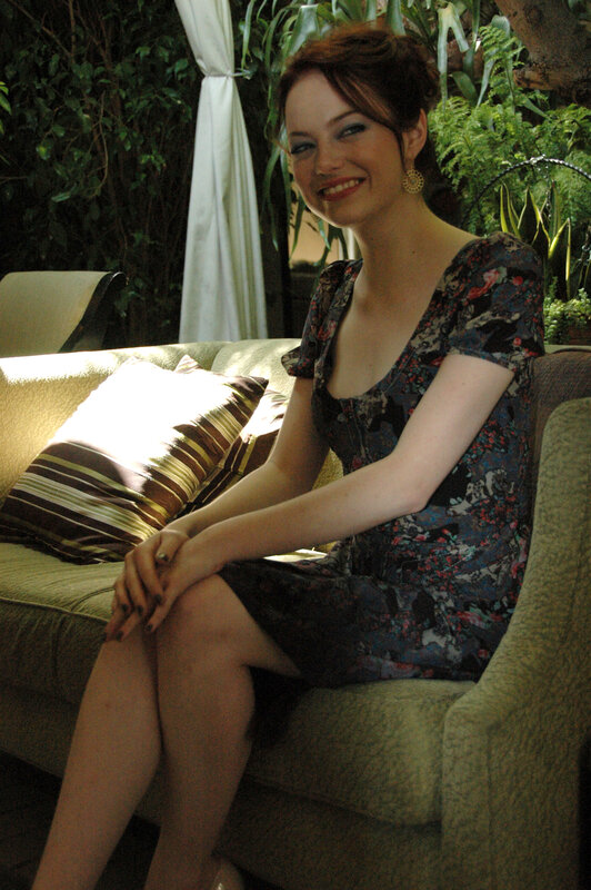 Woman in floral dress on couch