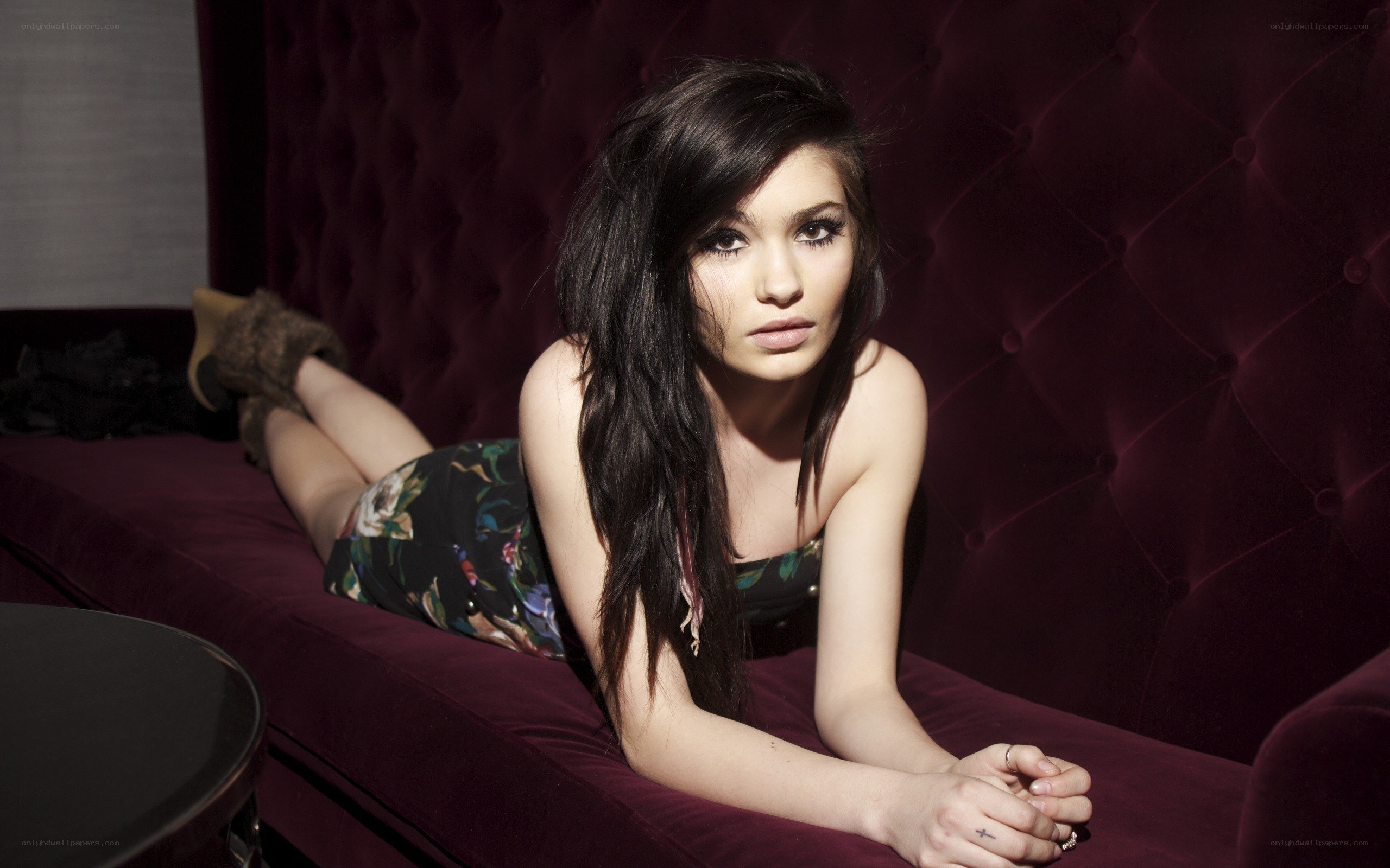 woman in floral dress on couch