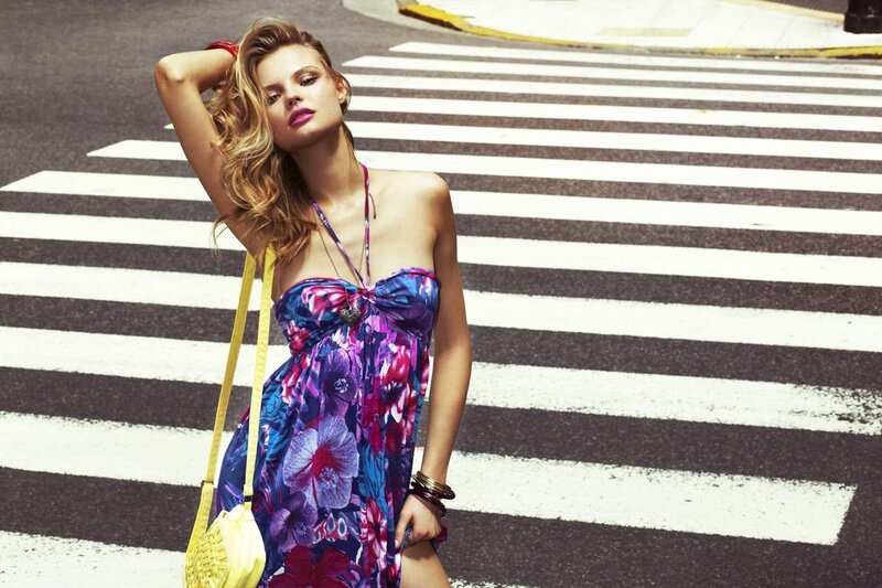 Woman in floral dress on crosswalk