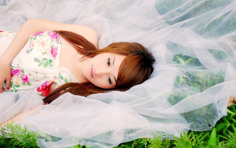 woman in floral dress on grass