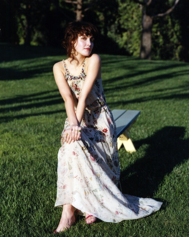 Woman in floral dress on grass