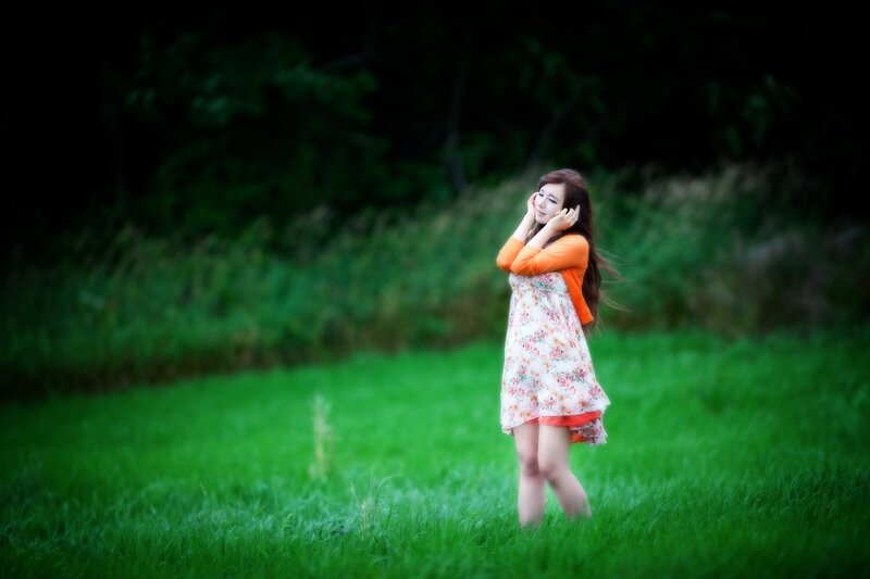 Woman in floral dress on grass