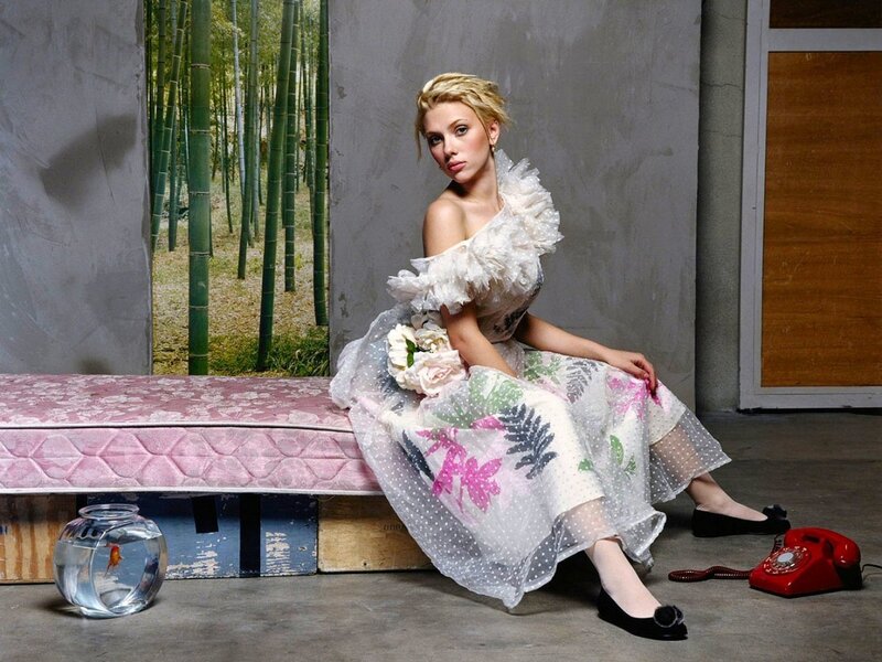 Woman in floral dress on mattress
