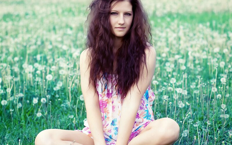 woman in floral dress on meadow