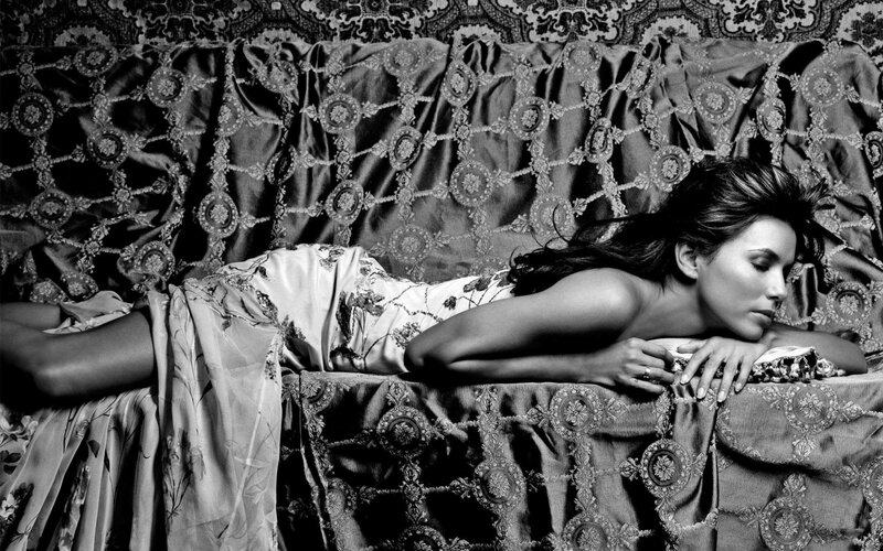 woman in floral dress on ornate couch