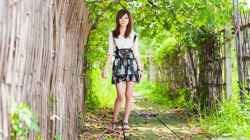 woman in floral dress on path