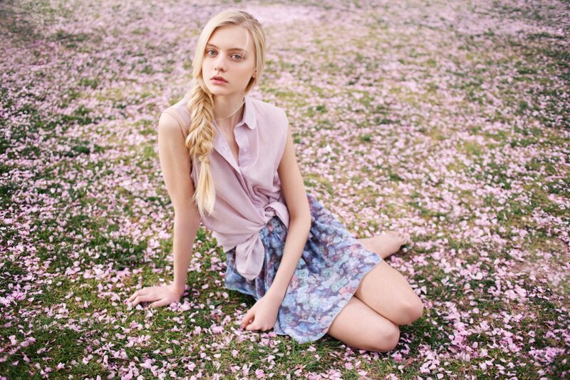 woman in floral dress on petals