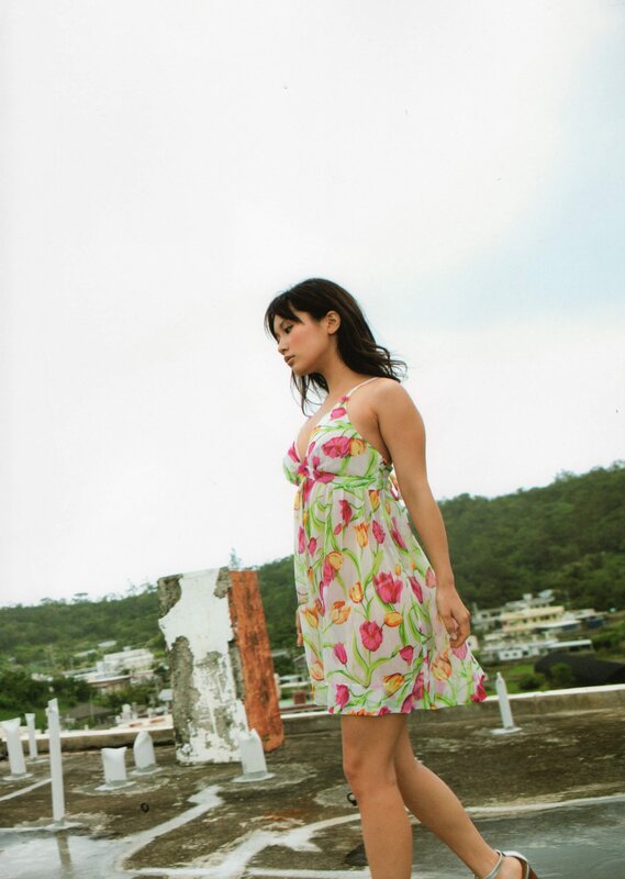 Woman in floral dress on rooftop