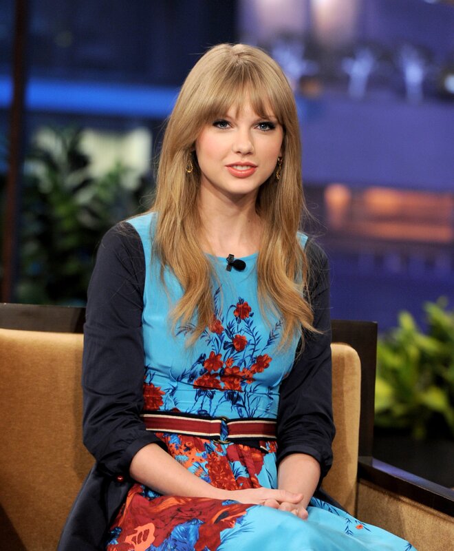 woman in floral dress on talk show