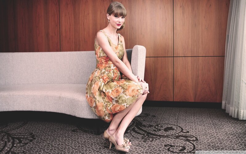 woman in floral dress sitting