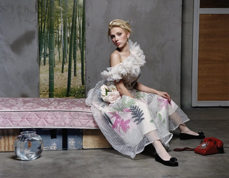 woman in floral dress sitting
