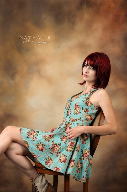 woman in floral dress sitting