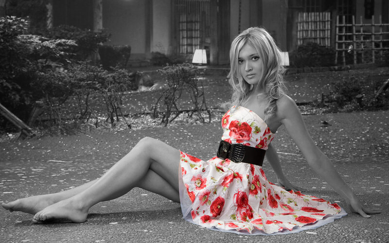 woman in floral dress sitting