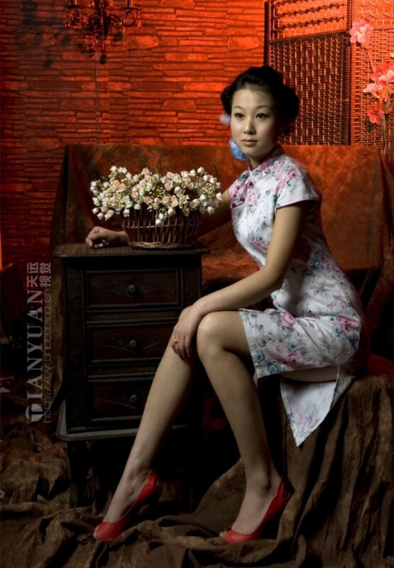 woman in floral dress sitting