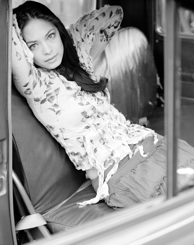 woman in floral dress sitting