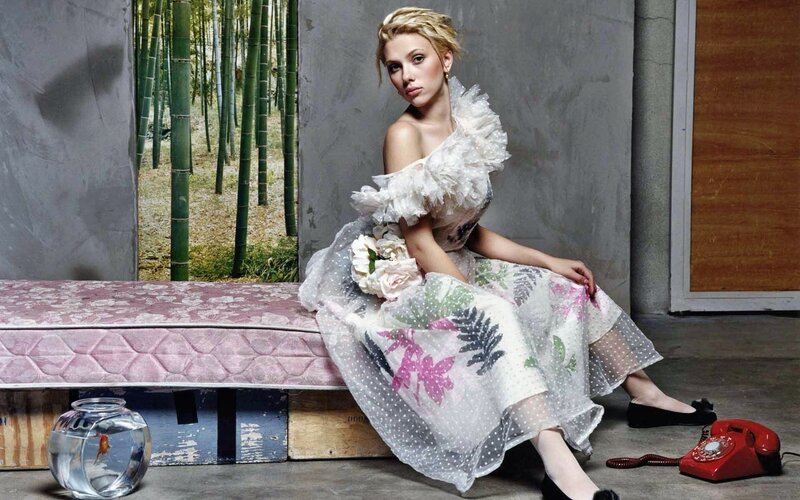 woman in floral dress sitting