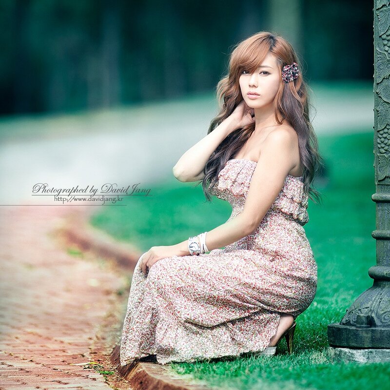 woman in floral dress sitting