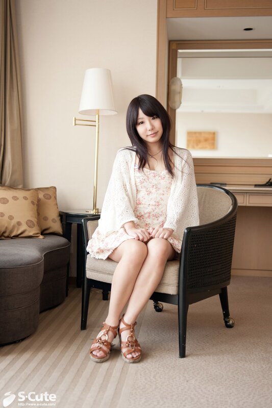 Woman in floral dress sitting
