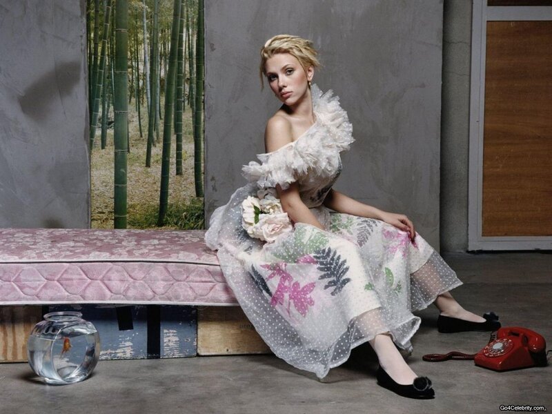 woman in floral dress sitting on bench