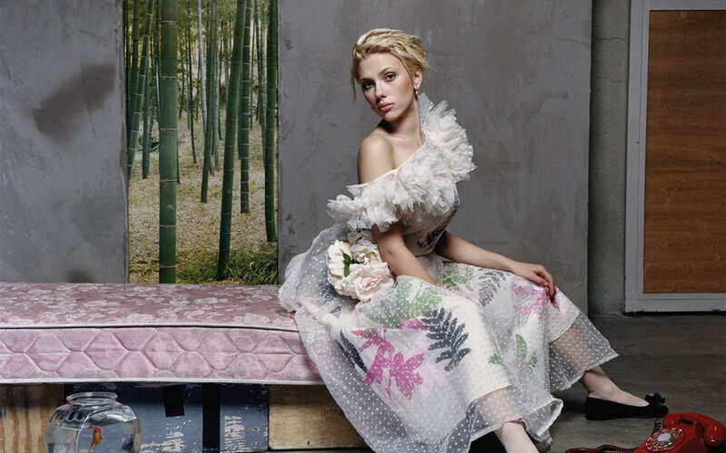 woman in floral dress sitting on bench