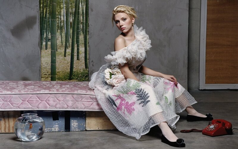 woman in floral dress sitting