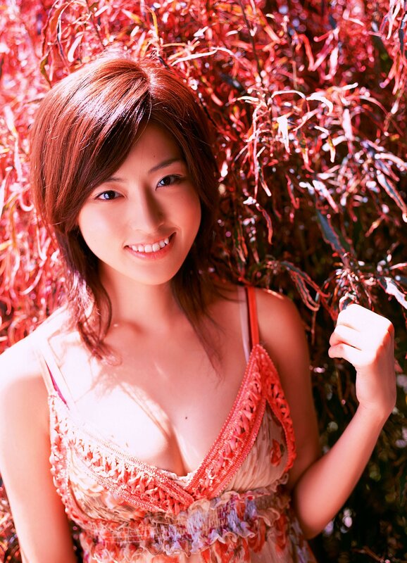 woman in floral dress smiling