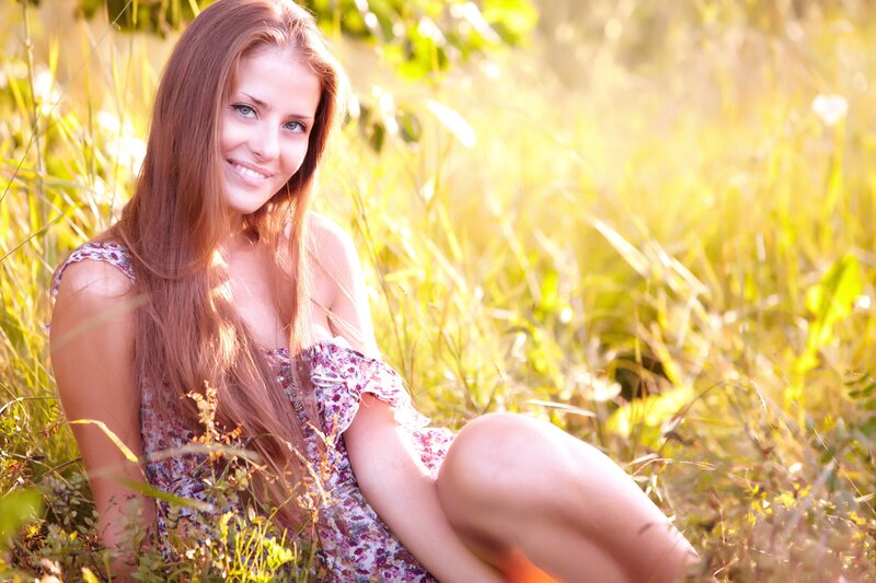woman in floral dress smiling