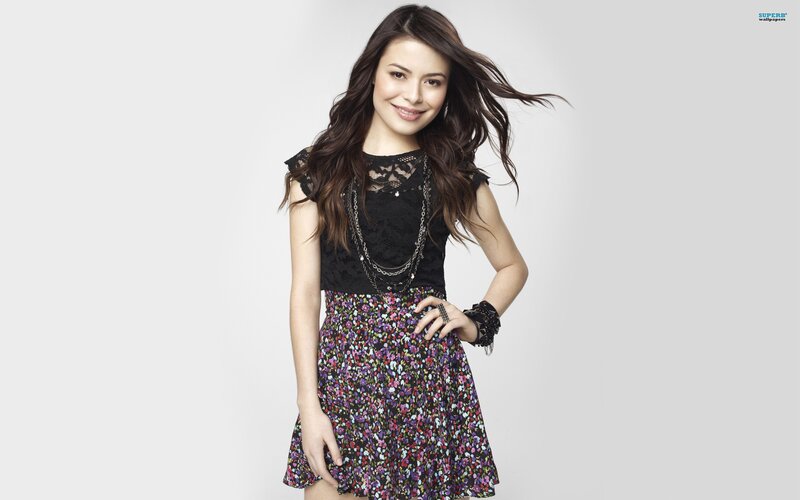 woman in floral dress smiling