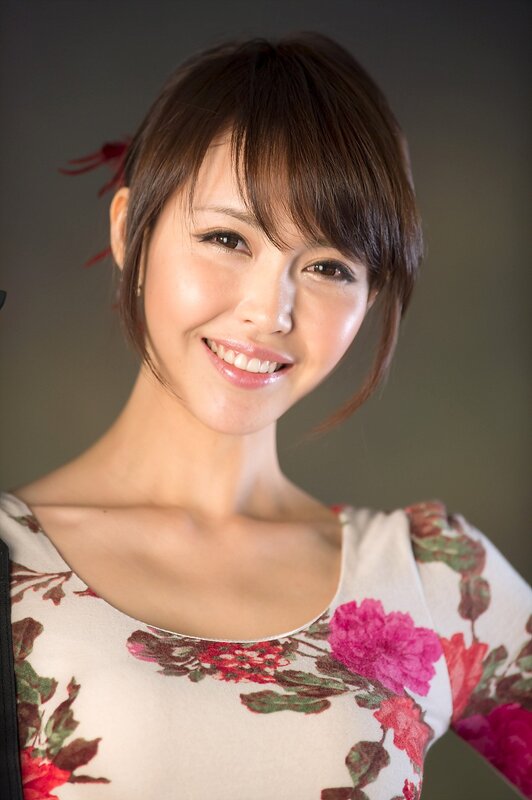 woman in floral dress smiling