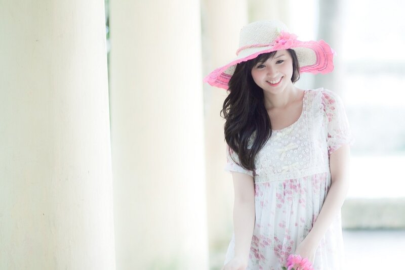 woman in floral dress smiling