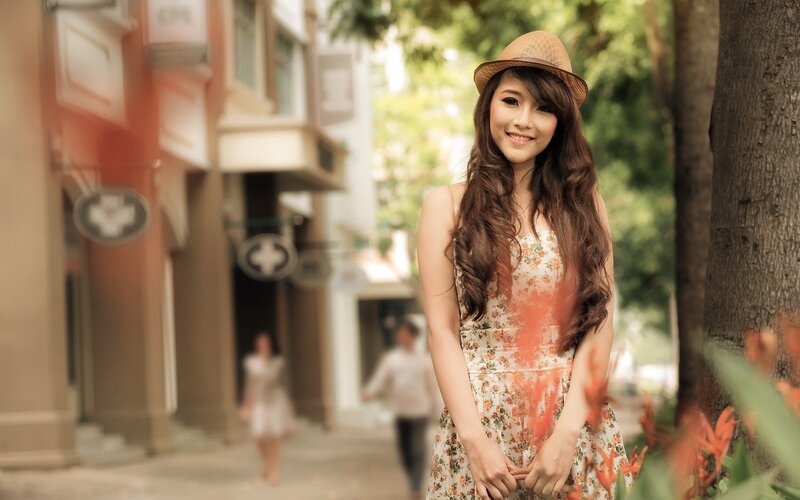 woman in floral dress smiling