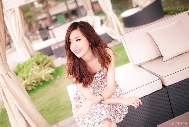 woman in floral dress smiling