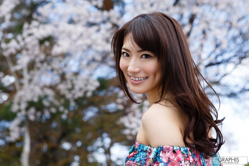 woman in floral dress smiling