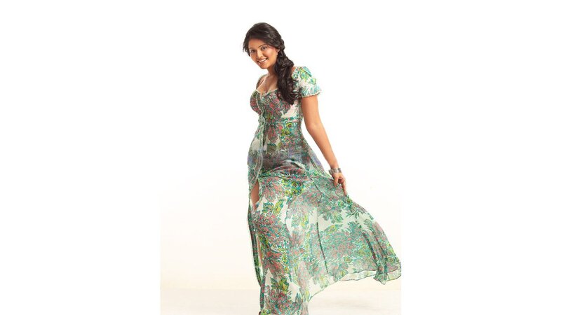 woman in floral dress smiling
