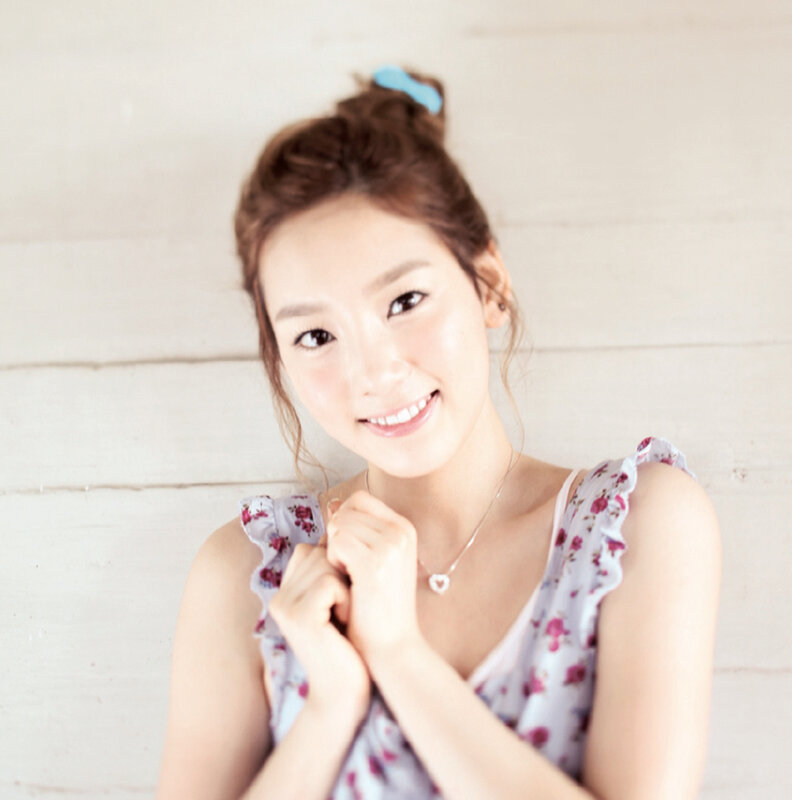 woman in floral dress smiling